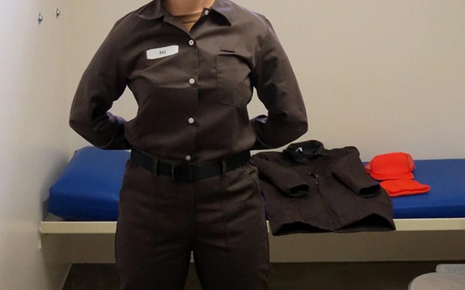 A sailor models the new pre-trial standardized prisoner uniform, which will be mandatory for all prisoners beginning Wednesday, May 1, 2019.
