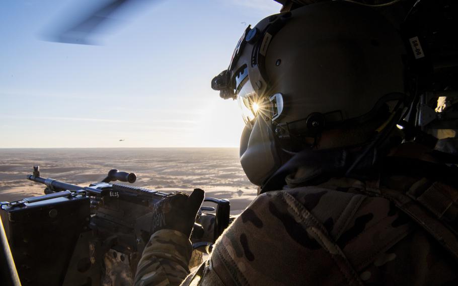 A U.S. Army flight medic with the 738th Air Expeditionary Advisory Group scans for threats Dec. 5, 2018, while participating in the NATO led Resolute Support mission in Afghanistan. The U.S.-led coalition in Afghanistan has stopped assessing whether the country?s districts are controlled by the government or insurgents.