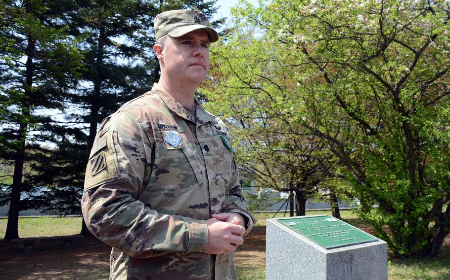 Army Lt. Col. Sean Morrow, commander of the United Nations Command Security Battalion, speaks to reporters Wednesday, May 1, 2019, near a memorial for Cpl. Jang Myong-ki, a South Korean soldier who was killed by the North Koreans in 1984 during a clash as a Soviet defector fled across the Joint Security Area to the South.