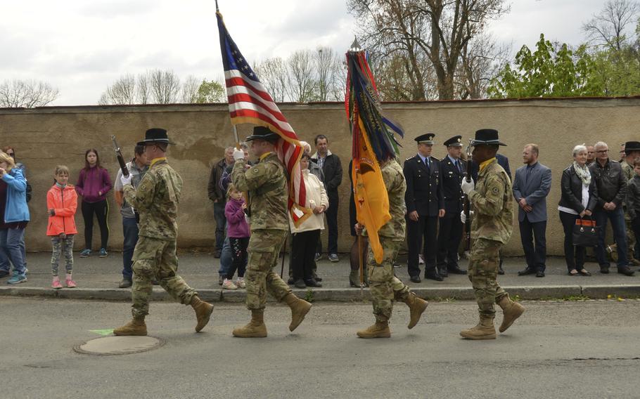 U.S. soldiers assigned to Eagle Troop, 2nd Squadron, 2nd Cavalry Regiment color guard march during the 74th anniversary of Operation Cowboy at the Hostoun Town Square, Houston, Czech Republic, on Tuesday, April 30, 2019.