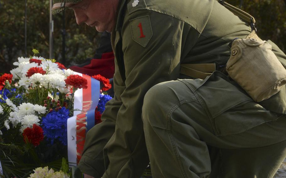 A Czech civilian lays down a wreath during the 74th anniversary of Operation Cowboy at Bela, Czech Republic, on Tuesday, April 30, 2019.