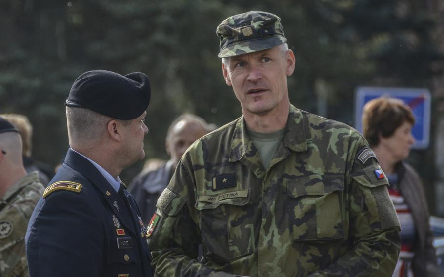 U.S. Army Maj. Kevin Hurtt, left, the Bilateral Affairs Officer at the U.S. Embassy in the Czech Republic, talks with Czech Army Maj. Jiri Stetina during the 74th anniversary of Operation Cowboy at the Bela Town Square, Bela, Czech Republic, on Tuesday, April 30, 2019.