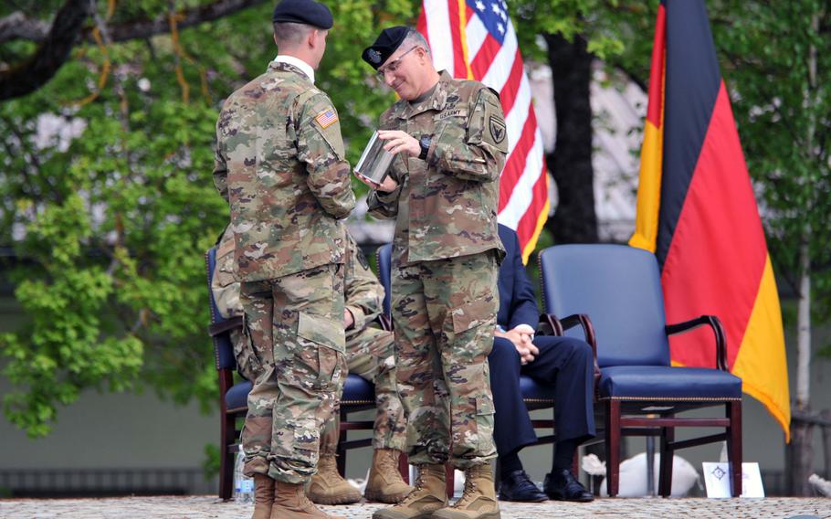 Outgoing U.S. EUCOM commander Gen. Curtis M. Scaparrotti receives a ceremonial shell casing from the salute battery at the U.S. European Command's change of command ceremony at Patch Barracks in Stuttgart, Germany, Thursday, May 2, 2019.