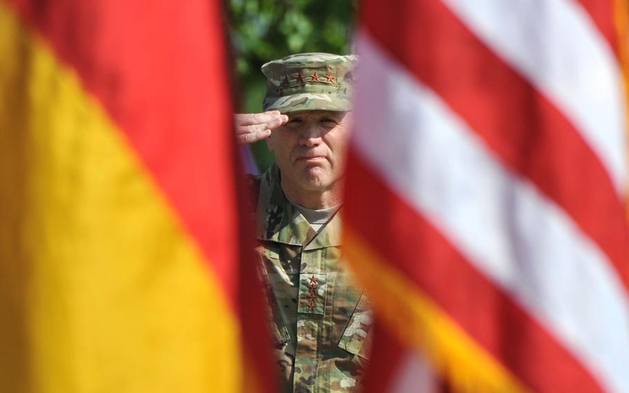 The incoming commander of  U.S. European Command, Air Force Gen. Tod D. Wolters, salutes during the playing of the German and American national anthems at the change of command ceremony at Patch Barracks in Stuttgart, Germany, Thursday, May 2, 2019.
