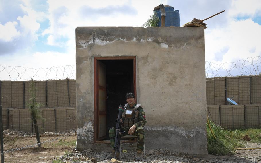 An Afghan soldier guards a remote outpost in Helmand province, the deadliest province in the country for Taliban attacks in 2018. 