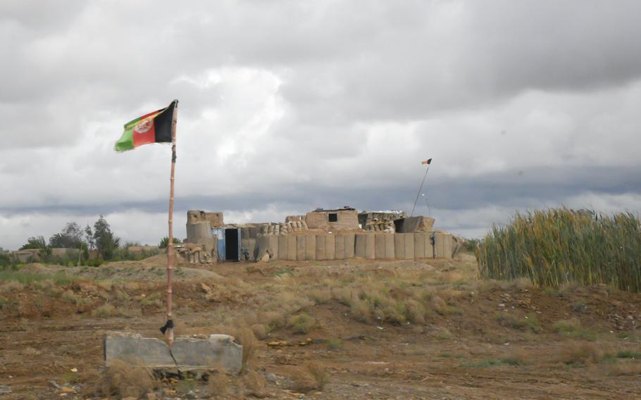 An Afghan army outpost watches over a highway in Helmand province.