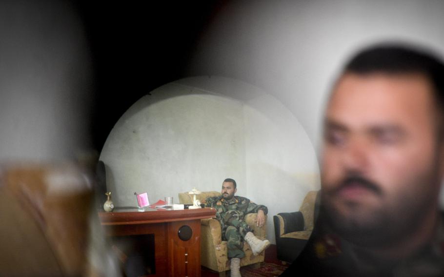 Photographed through a captured Taliban night-vision scope, Maj. Hedayat Rasoly, commander of the 3rd Kandak of the 215th Corps in Helmand province, said he faces constant threats from militant assassins.