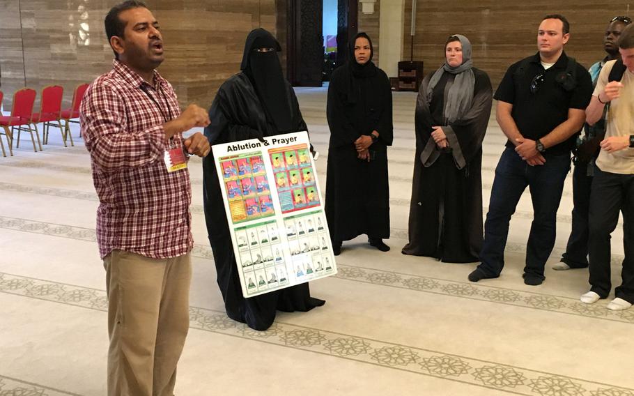 A guide answers questions for servicemembers at the Al-Fateh Mosque in Bahrain during a base indoctrination tour in August 2018.  Ramadan, the Muslim holy month, is set to begin May 6 and requires all expats in Bahrain to observe fasting laws during daylight hours.