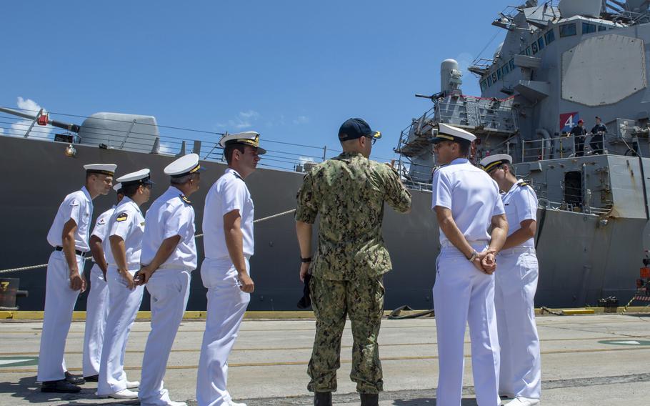 Cmdr. Isaac Harris, executive officer of the destroyer USS Ramage, gives a tour of the ship to Brazilian sailors during a port visit in Suape, Brazil in November 2018. President Donald Trump said he will grant special military status to Brazil, making it a ''major non-NATO ally'' in a move to boost cooperation.