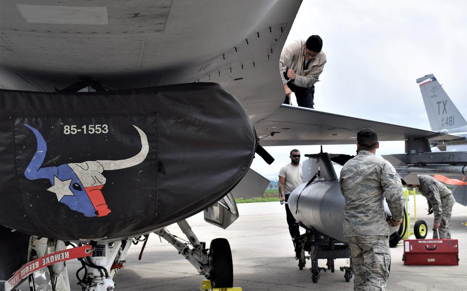 Airmen assigned to the 301st Fighter Wing, Naval Air Station Joint Reserve Base Fort Worth, Texas, maintain F-16C Fighting Falcons at Campia Turzii, Romania, May 6, 2019.