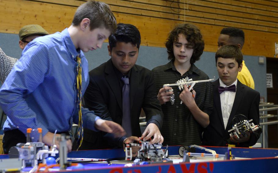 Ramstein Middle School students prepare their robots for the table demonstration during the robotics and music exhibition at Ramstein Middle School, Germany, May 9, 2019.