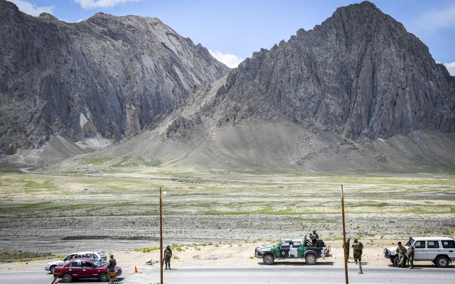 Afghan soldiers guard a highway checkpoint in Logar province on May 2, 2019. Almost half of Afghan troops killed or wounded last year were defending small checkpoints, sometimes manned by as few as four or five soldiers.