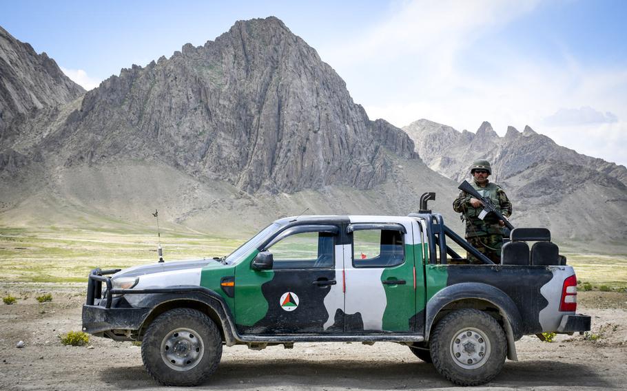 An Afghan soldier guards a highway checkpoint in Logar province on May 2, 2019. Almost half of Afghan troops killed or wounded last year were defending small checkpoints, sometimes manned by as few as four or five soldiers.