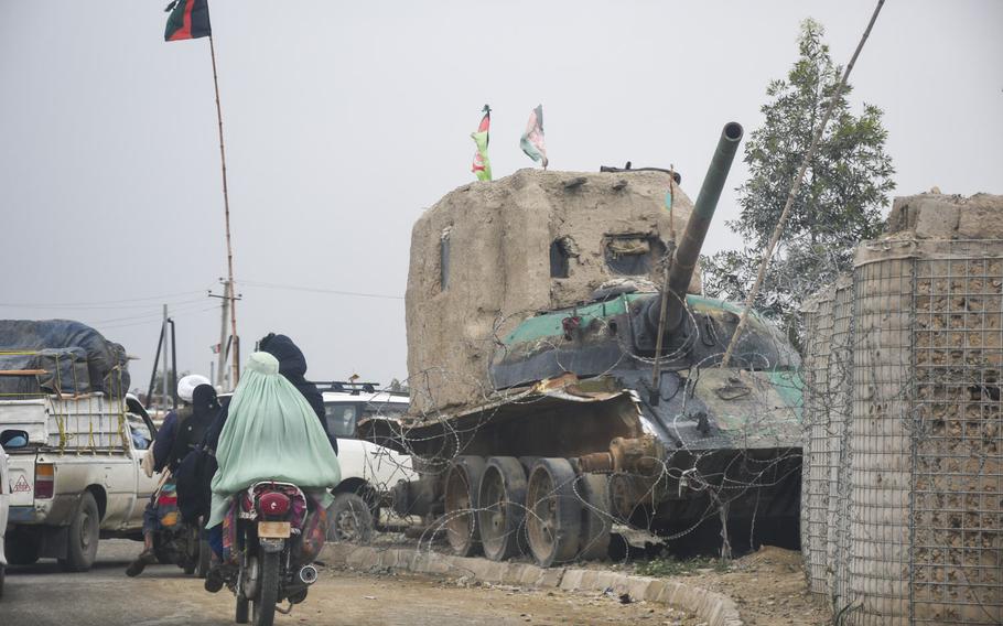A small checkpoint built around the wreck of a Soviet tank on the outskirts of Lashkar Gah, in Helmand province, April 14, 2019.  Almost half of Afghan troops killed or wounded last year were defending small checkpoints, sometimes manned by as few as four or five soldiers.