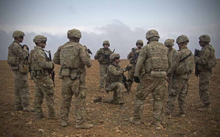 U.S. soldiers gather for a brief during a combined joint patrol rehearsal in Manbij, Syria, Nov. 7, 2018. U.S. military officials have said there is an elevated threat level facing U.S. troops deployed in Iraq and Syria, primarily from Iranian-controlled Shiite militias.