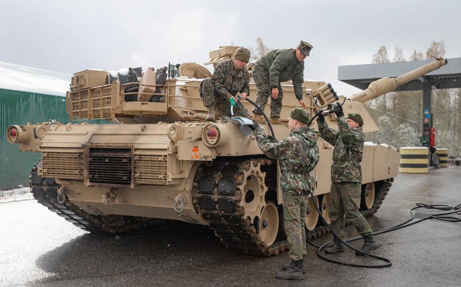 Marines with 2nd Tank Battalion, 2nd Marine Division, receive fuel from Finnish soldiers with 2nd Logistics Regiment, Logistics Command, during exercise Arrow 2019 at Niinisalo Garrison, Finland, May 4, 2019.