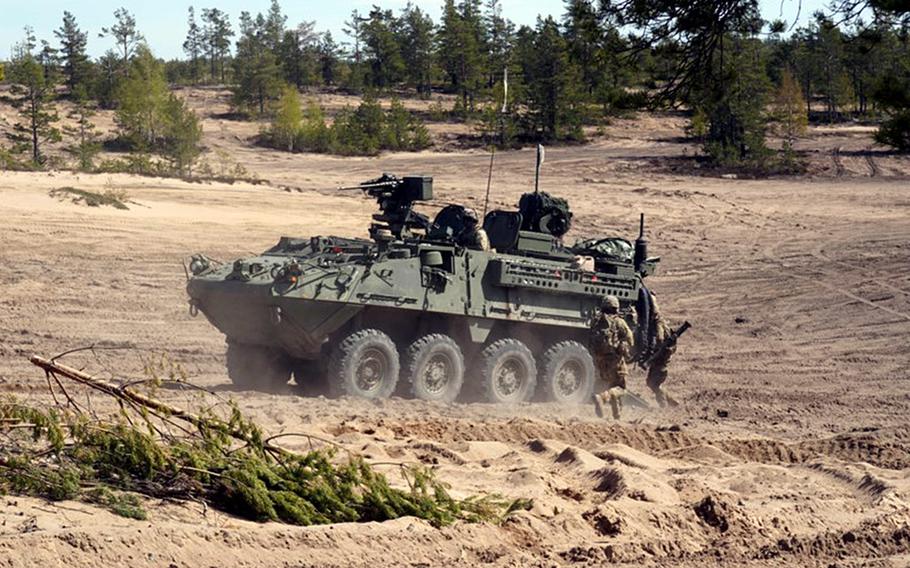 A U.S. Army Stryker Infantry Carrier Vehicle crosses the terrain during Exercise Arrow in the Pojankangas Training Area in Finland.