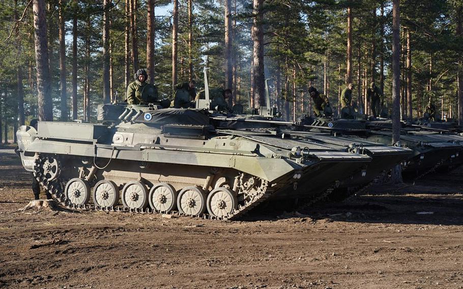 Finnish armored vehicles maneuver during Exercise Arrow in the Pojankangas Training Area in Finland.