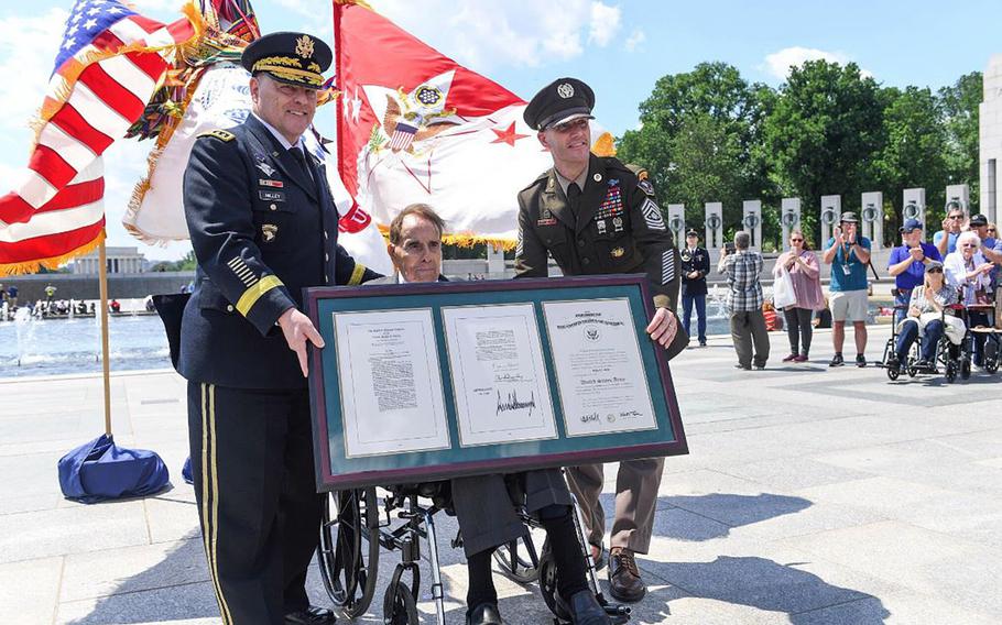 Former U.S. senator Robert Dole was promoted to the honorary rank of colonel in a ceremony presided over by Army Chief of Staff Gen. Mark Milley, at the World War II Memorial on the National Mall, May 16, 2019. At right is Sgt. Maj. of the Army  Daniel A. Dailey.