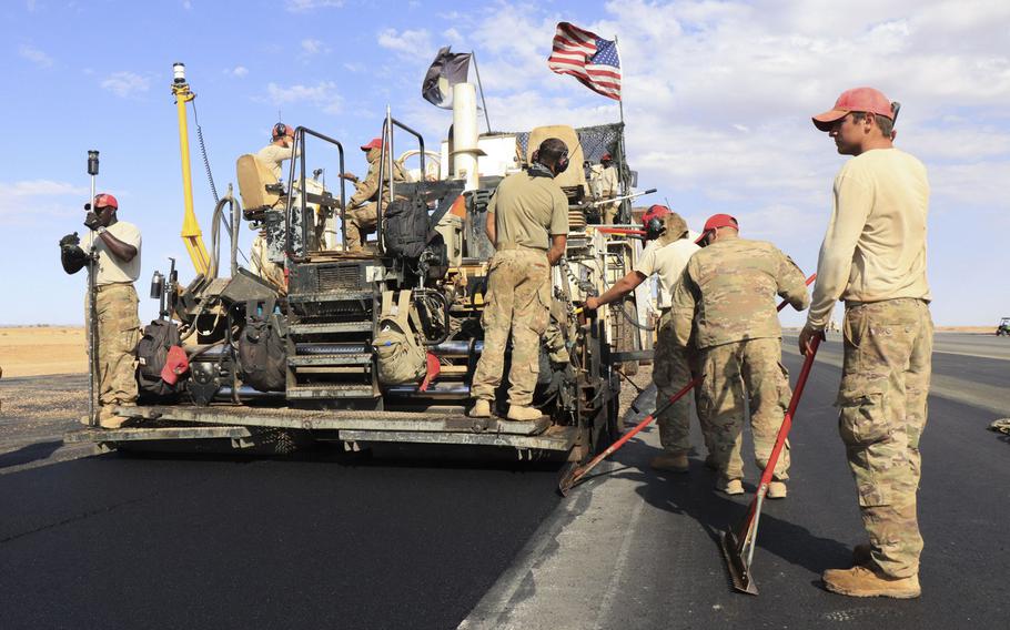 Airmen from the 31st Expeditionary Squadron use a steamroller to level asphalt while paving a flight line on Nigerien Air Base 201, Niger, in December 2018.  The U.S. military?s new base is scheduled to open this summer.