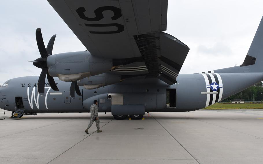 A C-130J from Ramstein Air Base, Germany, sports a 'W7' and "invasion stripes," a vintage paint scheme to commemorate the 75th anniversary of the D-Day invasion in Normandy, France. C-47 aircraft from the former 37th Troop Carrier Squadron were painted with similar markings when dropping paratroopers in Normandy on D-Day.
