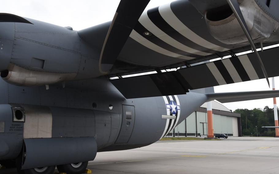 ''Invasion stripes'' can be seen underneath the wing of a C-130J parked at Ramstein Air Base, Germany, Wednesday, May 29, 2019. Four of the aircraft from the base's 37th Airlift Squadron received the vintage paint scheme and will participate in events next week to mark the 75th anniversary of D-Day in Normandy, France.