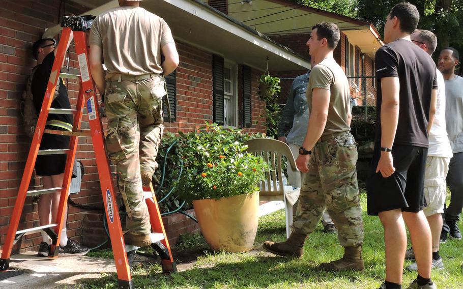 Soldiers from Fort Benning, Ga. repair the home of a veteran in March as volunteers with nonprofit Warrior Outreach. Photo provided by Warrior Outreach.