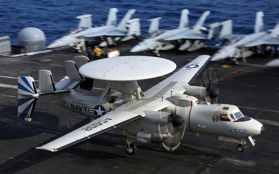 An E-2D Hawkeye from Carrier Airborne Early Warning Squadron 121 lands aboard the aircraft carrier USS Abraham Lincoln in the Atlantic Ocean, Feb. 18, 2019.