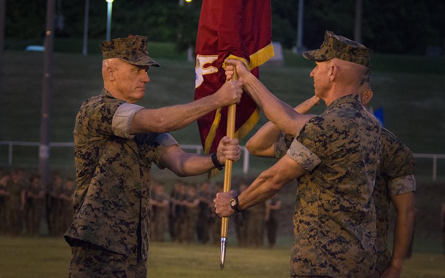 Lt. Gen. H. Stacy Clardy III, left, assumes command of the III Marine Expeditionary Force from Lt. Gen. Eric Smith, right, at Camp Courtney, Okinawa, May 31, 2019.