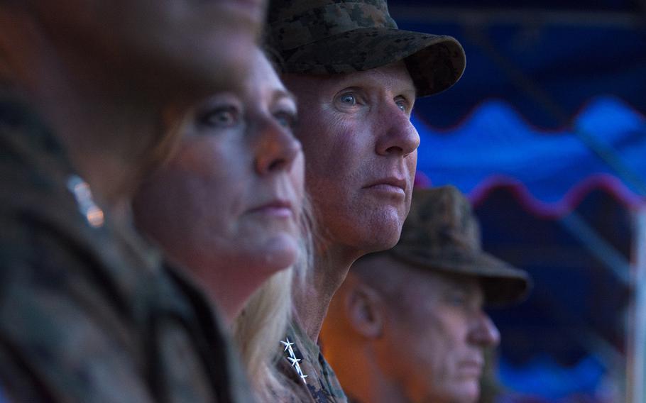 Lt. Gen. Eric Smith, center, attends the III Marine Expeditionary Force change-of-command ceremony at Camp Courtney, Okinawa, May 31, 2019.