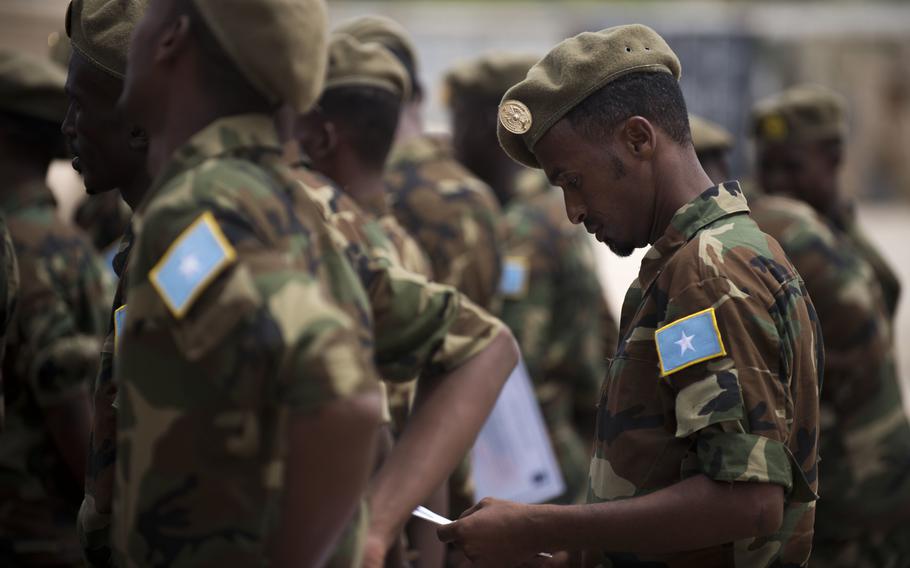 A Somali national army soldier stands in formation after receiving a training certificate after completing 14 weeks of logistical operations training with the U.S. 10th Mountain Division.