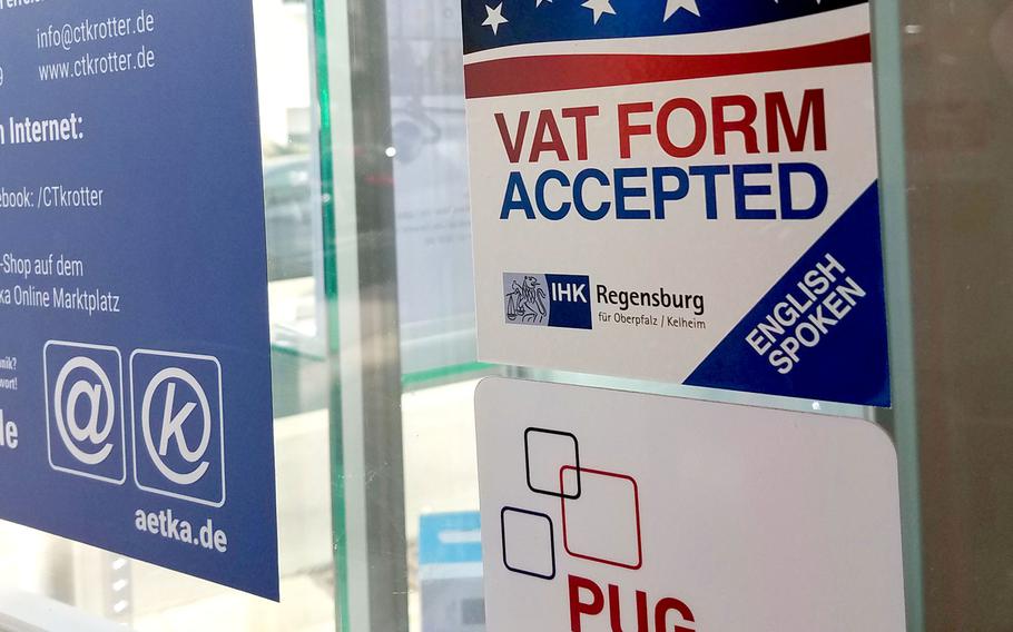 A sticker on a German cellphone store showing that they accept VAT forms, near Hohenfels, Germany, Friday, May 31, 2019.
