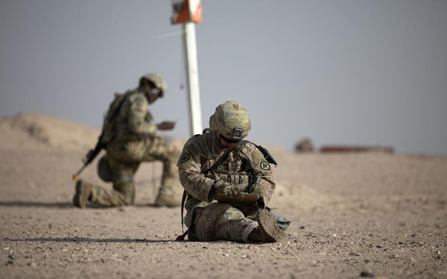 Staff Sgt. Bi Chen, a squad leader with 2nd Battalion, 113th Infantry Regiment, New Jersey Army National Guard, plots a point on his map during Expert Infantryman Badge testing at the Udairi range in Kuwait on Monday, May 27, 2019. Chen and 127 U.S. Army, Army National Guard and Army Reserve Soldiers demonstrated their ability to navigate from one point to another using a map and compass, one of 34 events EIB candidates must complete before being awarded the badge.