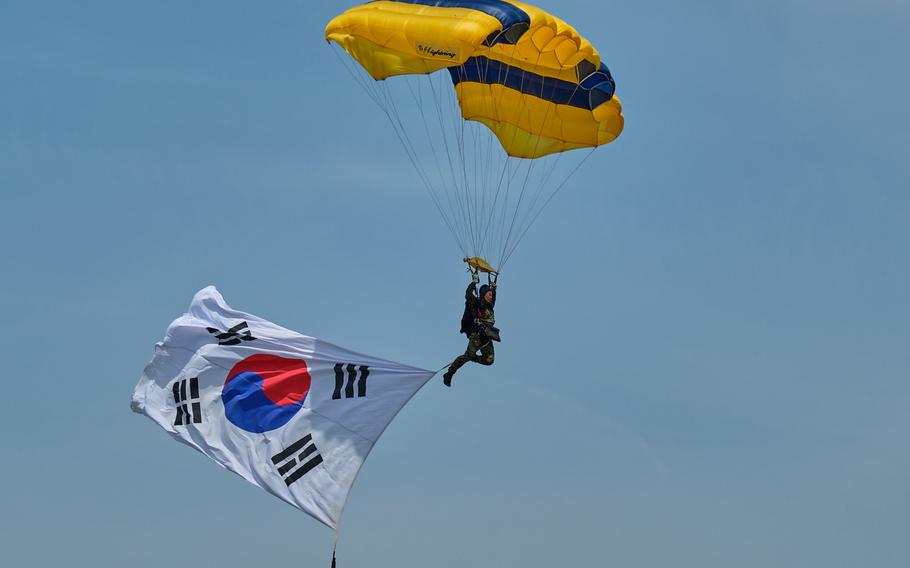 A member of South Korea's Special Operations Command parachute team jumps during the Eighth Army's 75th anniversary celebration at Camp Humphreys, South Korea, Saturday, June 8, 2019.