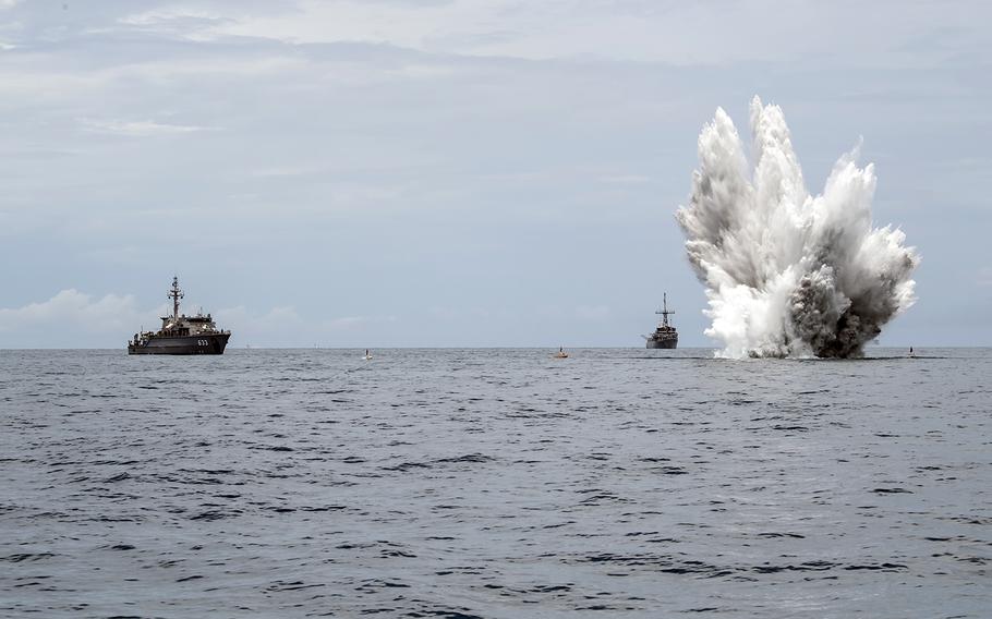 The Royal Thai Navy mine countermeasures ship HTMS Lat Ya, left, and the Avenger-class mine countermeasures ship USS Pioneer observe a controlled mine detonation during Cooperation Afloat Readiness and Training in the Gulf of Thailand, June 7, 2019.