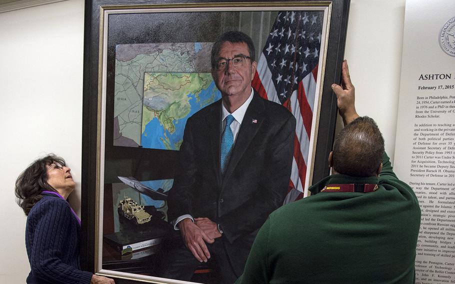 The official portrait of former Secretary of Defense Ash Carter is hung at the Pentagon in Washington, D.C., Feb. 2, 2018. Carter served as the 25th defense secretary from February 2015 until January 2017.