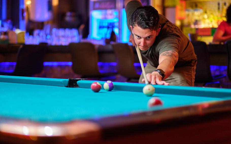 Air Force Staff Sgt. Cody Meyer of the 33rd Rescue Squadron plays pool at a bar just outside Osan Air Base, South Korea, Monday, June 17, 2019.