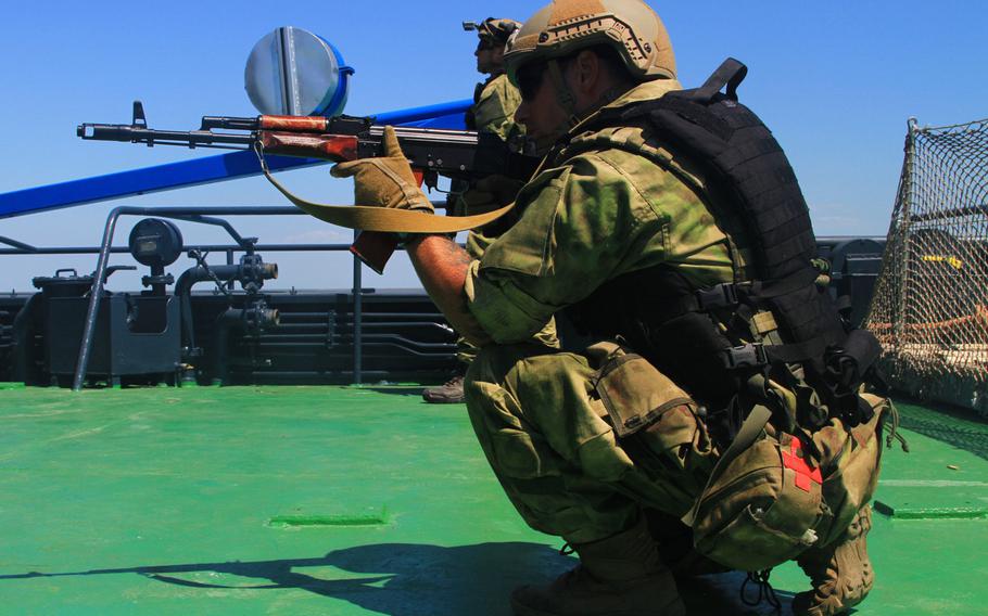 During boarding training in the Black Sea, a Ukrainian special operations soldier provides security alongside U.S. special operators during exercise Sea Breeze in 2017. The U.S. is increasing military aid to Ukraine, with a focus on helping beef up the country’s navy and marines.
