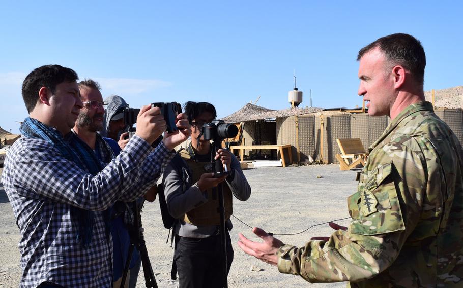 Lt. Col. Joshua Thiel speaks with international and Afghan media at an outpost in eastern Afghanistan, Jul. 7, 2018. The Taliban have announced they will start targeting Afghan media outlets that transmit government-sponsored anti-Taliban announcements.