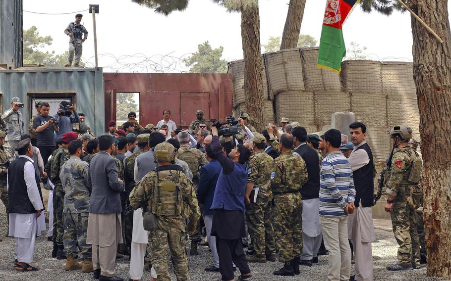 Afghan media and local community members document the arrival of Army Gen. John Nicholson, then-Resolute Support Mission commander, during his visit to the provincial governor's compound in Kunduz Province, Afghanistan, July 5, 2018. The Taliban have announced they will start targeting Afghan media outlets that transmit government-sponsored anti-Taliban announcements. 

Sharida Jackson/U.S. Air Force