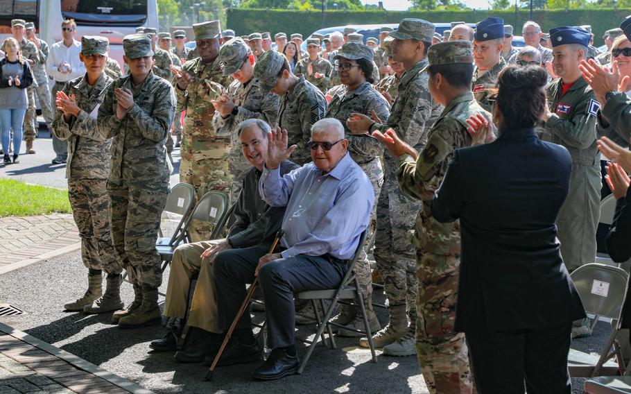 Dewey R. Christopher, center, waves to the airmen and civilians assembled for a ceremony at RAF Mildenhall to rename the Professional Development Center after him on Friday, June 21, 2019.