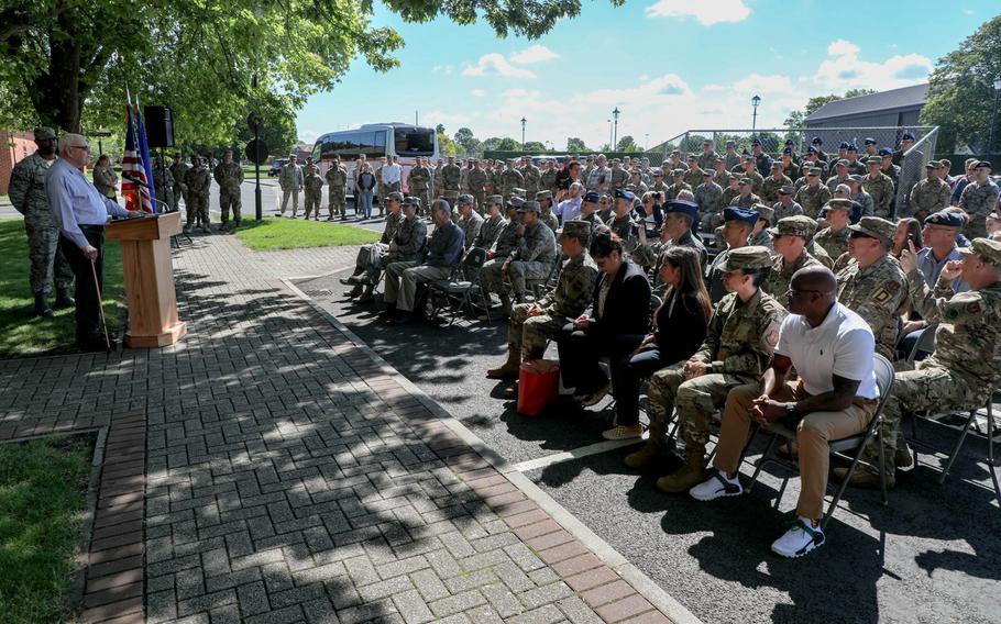 Dewey R. Christopher, left, speaks to airmen and civilians at a ceremony at  RAF Mildenhall to rename the Professional Development Center after him, on Friday June 21, 2019.