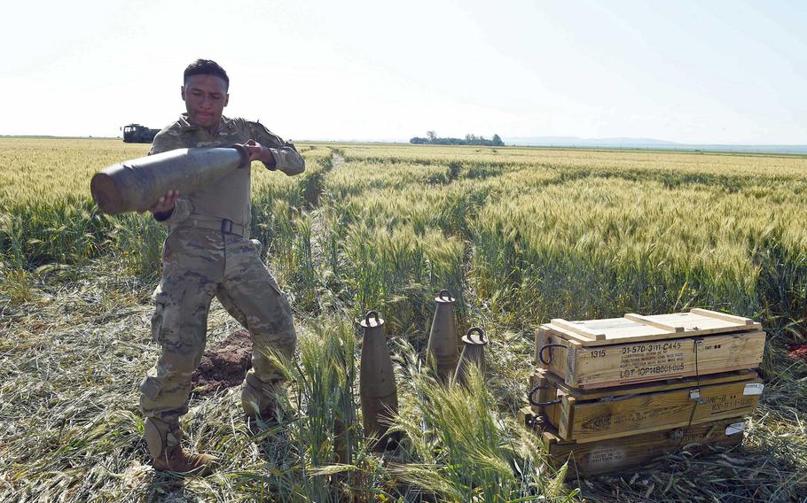 Pfc. Eduardo Ortega, an artilleryman with the 173rd Infantry Brigade Combat Team (Airborne) picks up a howitzer shell, during Exercise Swift Response, Friday, June 14, 2019.
