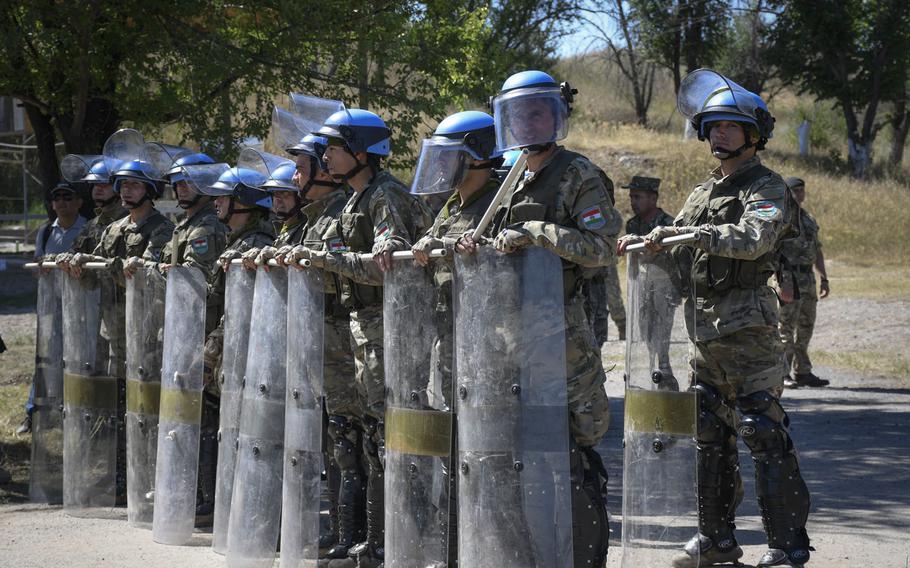 Soldiers from Tajikistan prepare a shield wall after responding to a crowd of rioters as part of a training exercise between American, British and Kazakh troops June 24, 2019. The Steppe Eagle exercise at the Chilikemer Training Area outside of Almaty trained Kazakh troops before their United Nations mission to Lebanon in the fall.