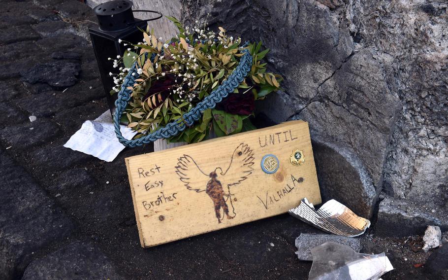 A small memorial left by soldiers at the city gate of Hahnbach, where Spc. Abinezer Gebeyehu crashed his car and died, May 27, 2019.
