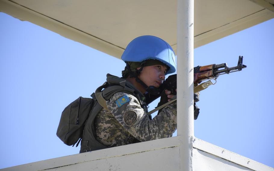 A soldier with the Kazakh ground forces' peacekeeping battalion responds to a simulated attack on his base during  the U.S.-led Steppe Eagle exercise on June 25, 2019. Kazakhstan?s contributions to global peacekeeping and security efforts have increased after more than a decade of such training.