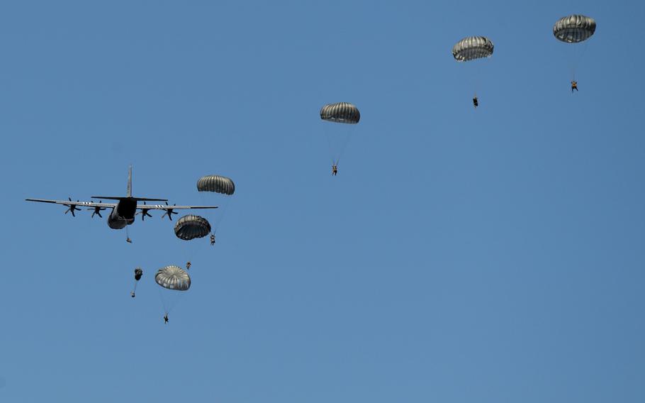 Paratroopers assigned to the 435th Contingency Response Group at Ramstein Air Base jump out of a 37th Airlift Squadron C-130 Hercules over the air base Tuesday, July 2, 2019.