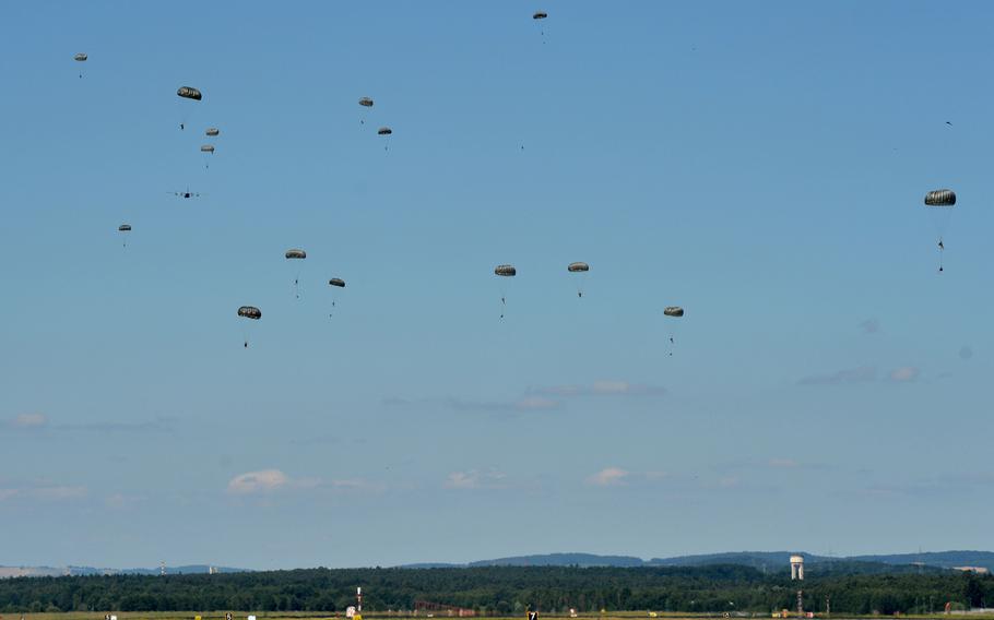 Paratroopers of the 435th Contingency Response Group out of Ramstein Air Base, Germany float down to the base after jumping out of a C-130 Hercules from the 37th Airlift Squadron, Tuesday, July 2, 2019.  The 435th CRG is USAFE's only expeditionary "open-the-base" force. The unit's last real-world deployment was to Mozambique for humanitarian relief efforts after Cyclone Idai.