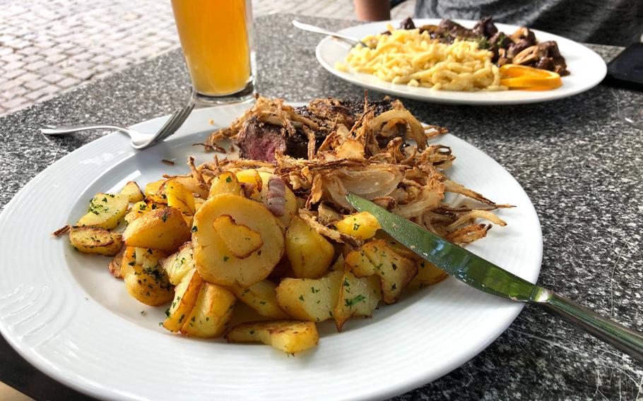 The steak with onions and potatoes at BurgRestaurant at Lichtenberg Castle, is cooked to order. Our group of three decided it was the best meal of the night.