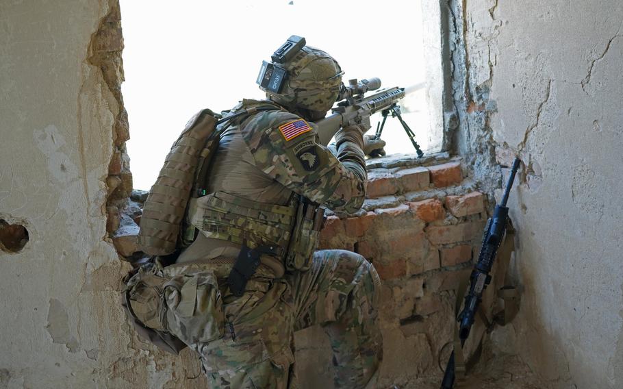 A U.S. soldier from 2nd Squadron, 2nd Cavalry Regiment, scans the area for troops to determine if they properly employed camouflage and concealment during training at the Agile Spirit 19 exercise near Tbilisi, Georgia, July 30, 2019.